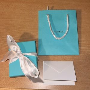 Tiffany & Co. gift bag, box with jewelry pouch, and letter/envelope